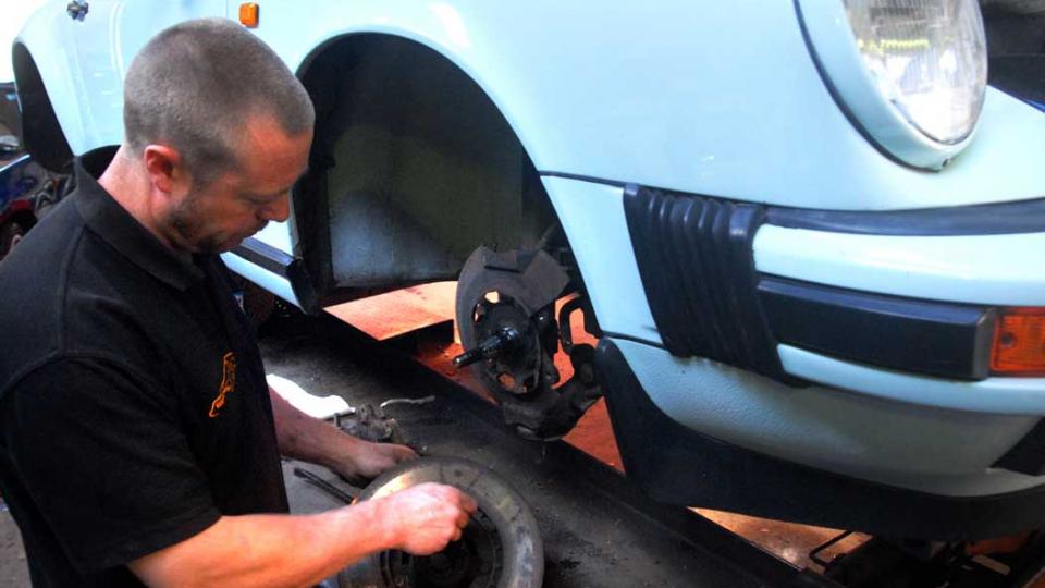 New front brake discs and pads for servicing a Porsche 911