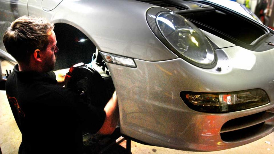 fitting front cooling pipes and hoses to the Porsche 997