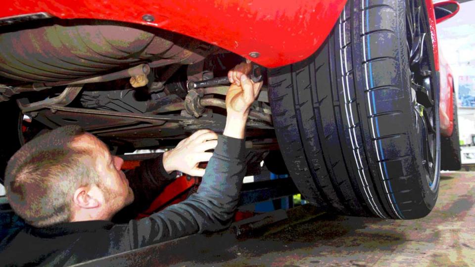 Adjusting wheel allignment on the rear of the Porsche Boxster