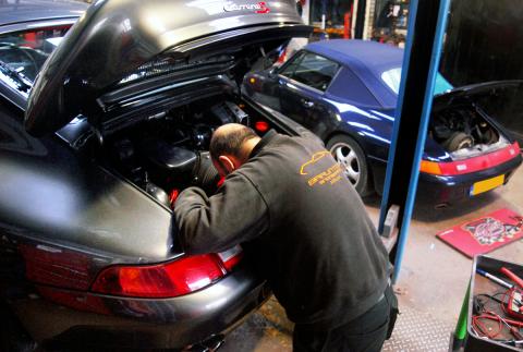 Ashley tends to a Porsche 993 with servicing and repair