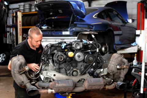 dave looks at a 996 engine removed from a Porsche 996 Carrera