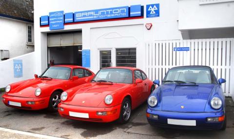 Porsche 964 in a line in front of the garage